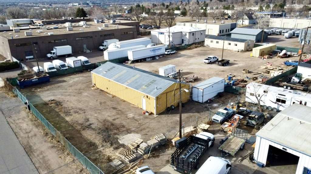 Industrial yard for sale in Wheat Ridge with warehouse and mobile office